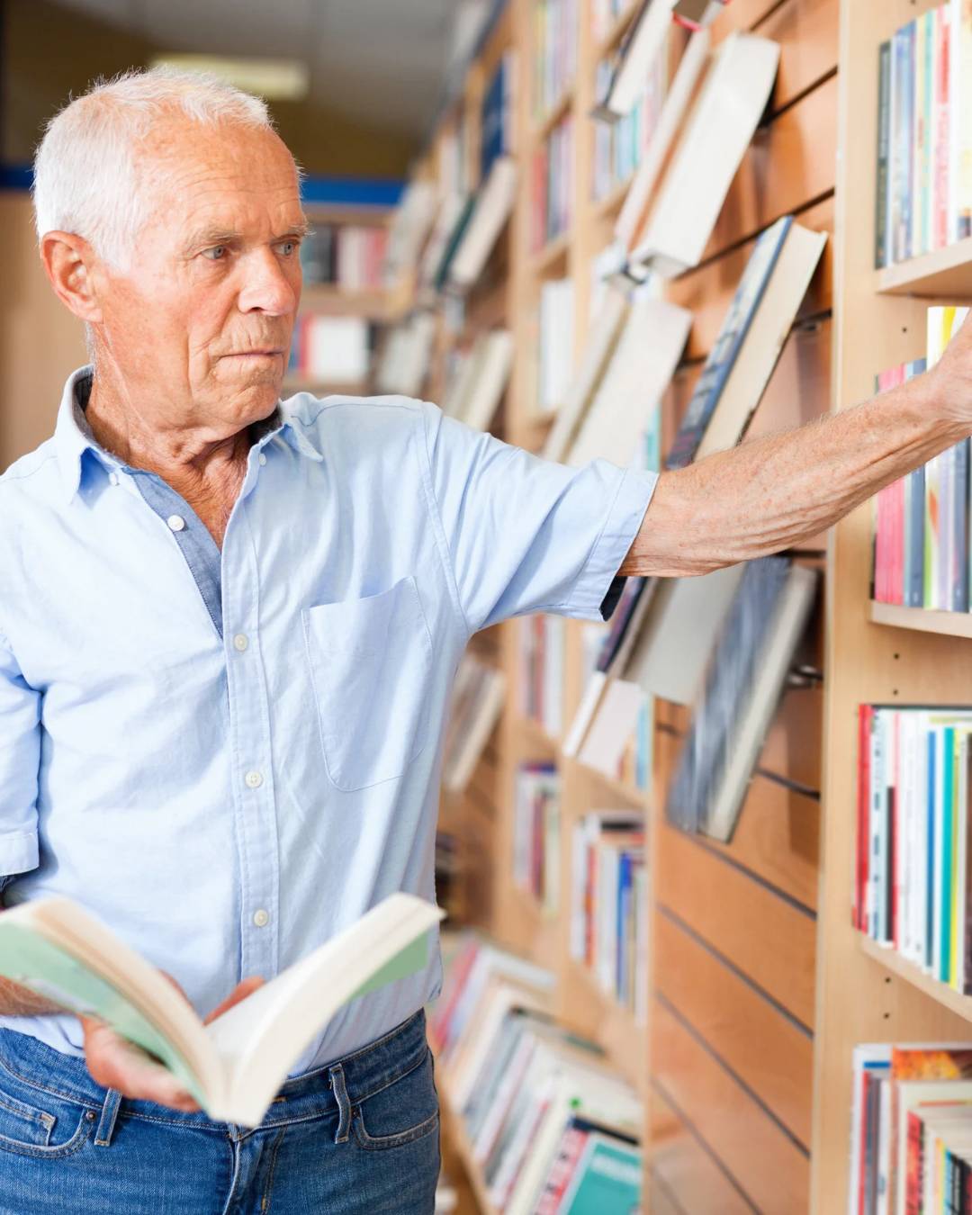 Person at library checking out books.